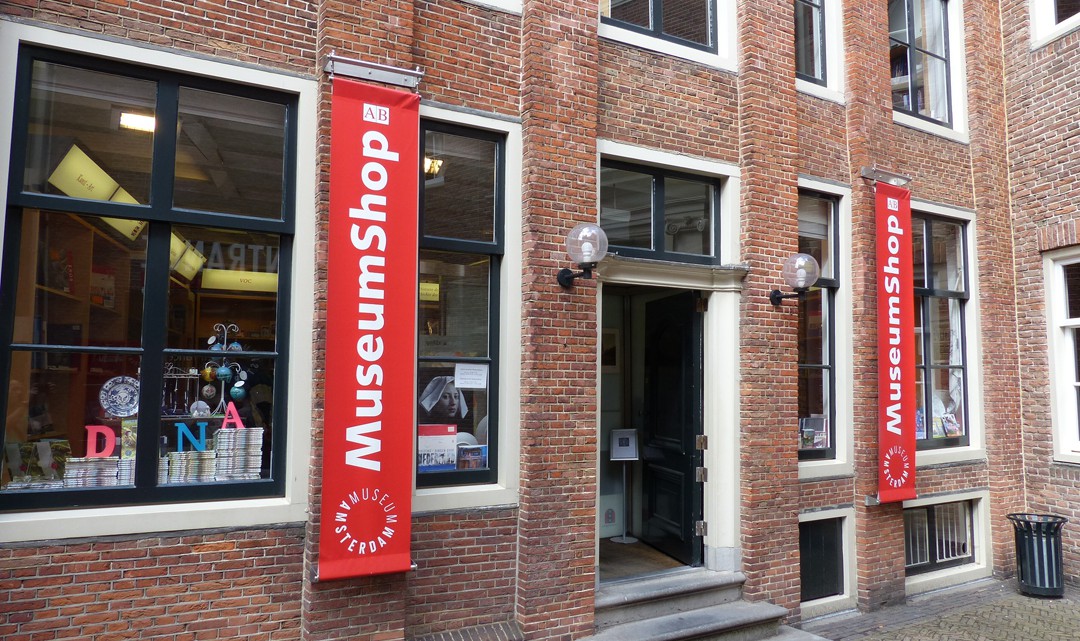 The entrance to the museum shop with banners on the side of the door