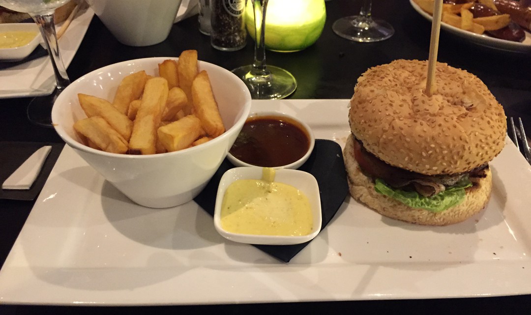 A plate with the delicious burger