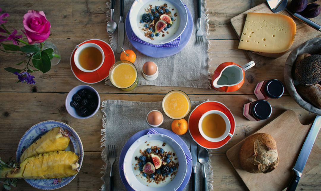 A set breakfast table from above with delicious food