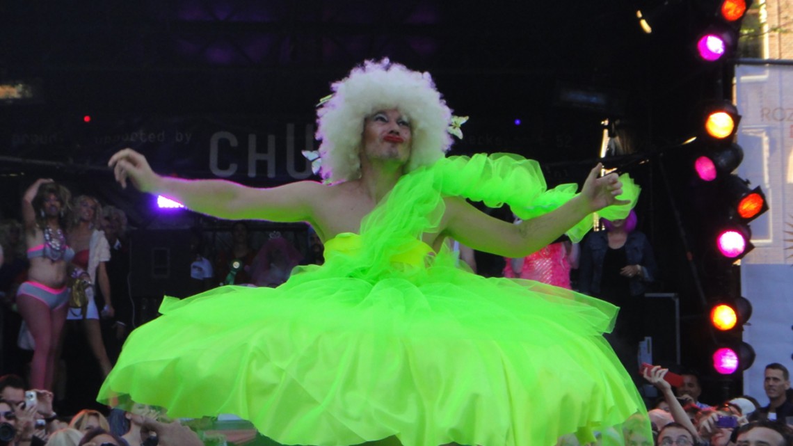 Fluorescent drag queen at the handbag toss