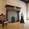Two performers in a historic canal house room