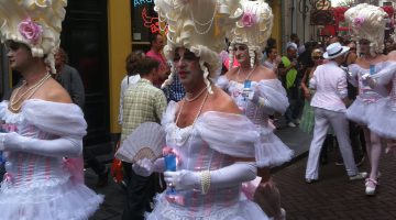 A group of elaborately dressed drag queens