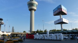 Iamsterdam sign in front of Schiphol air traffic control tower