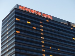 Name sign at the top of the hotel in twillight