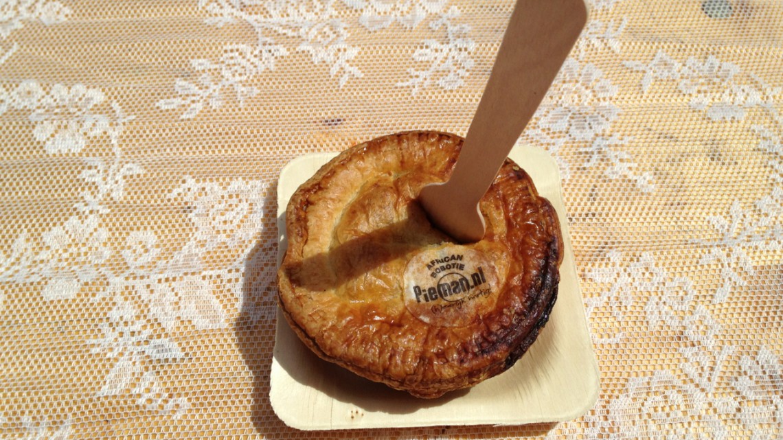 A small one person's hearty pie with a wooden fork 'stabbed' in it