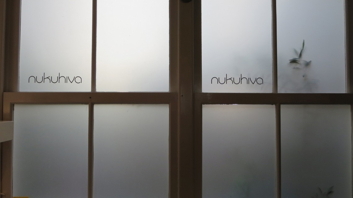 Milky glassed windows with the logo of Nukuhiva