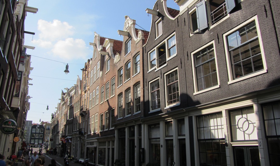 A row of typical Amsterdam houses in a small street