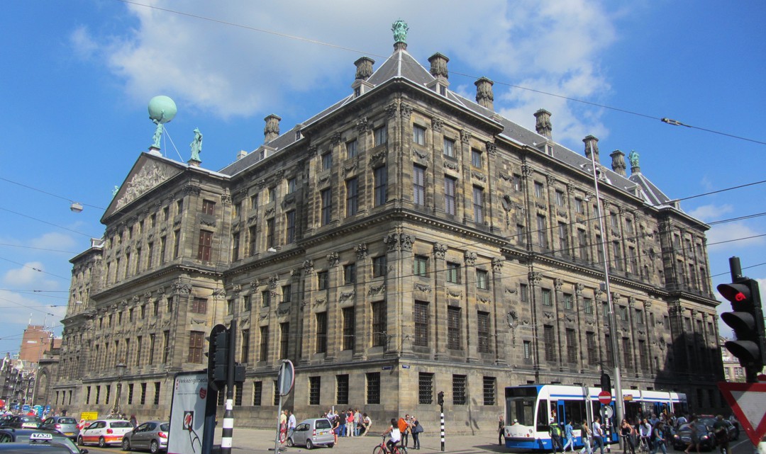 The Royal Palace as seen from the back with traffic and a tram in front of it