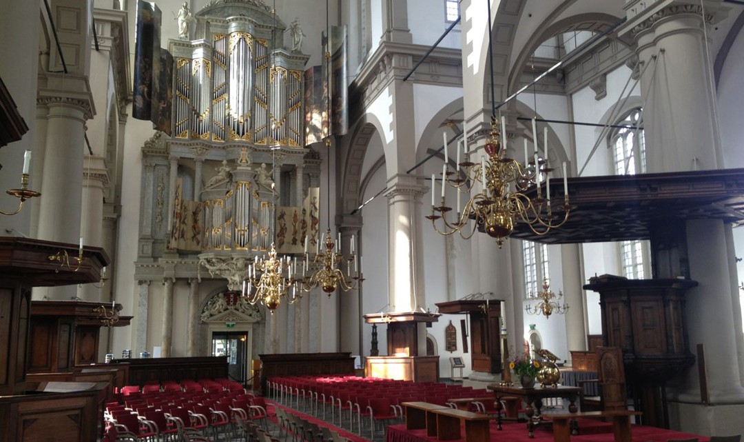 The organ and pulpit in the sober interior