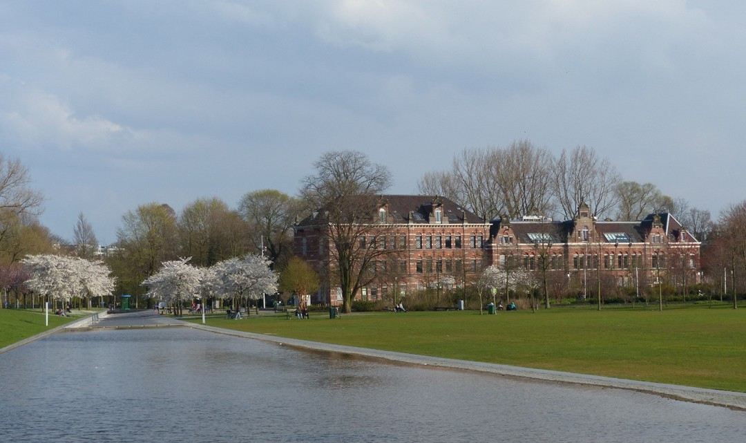 Water, blossoming trees and a historic building