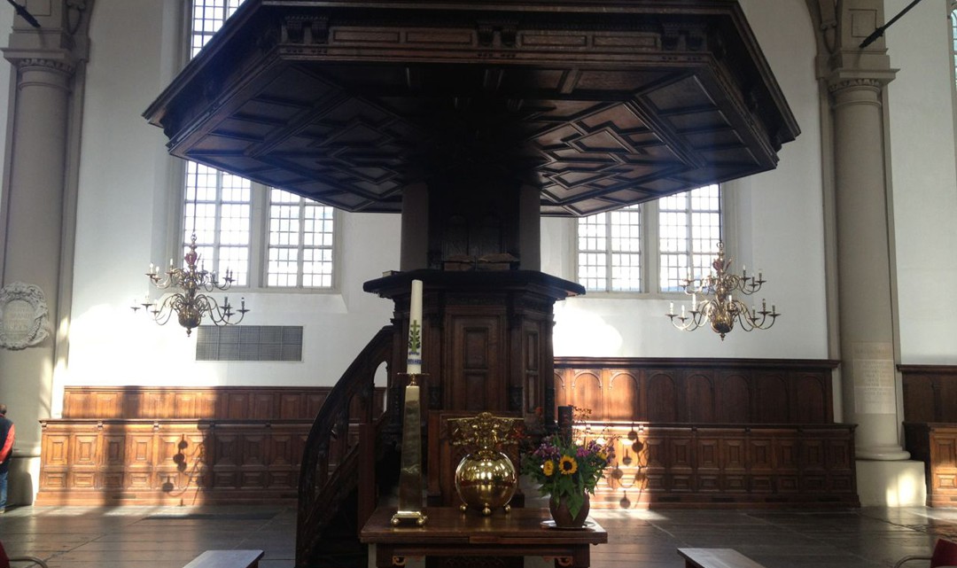 The dark wooden pulpit